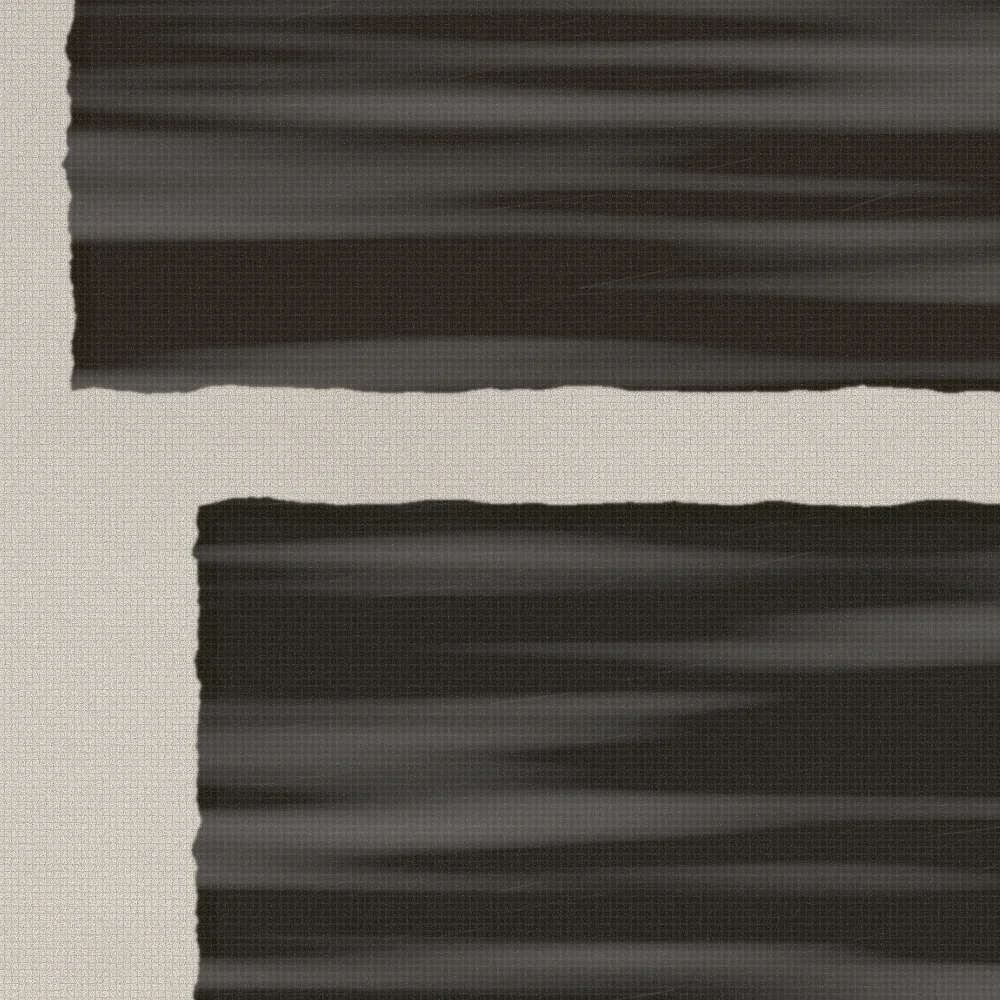 Close-up of a graphite block showing the layered, burnished surface.
