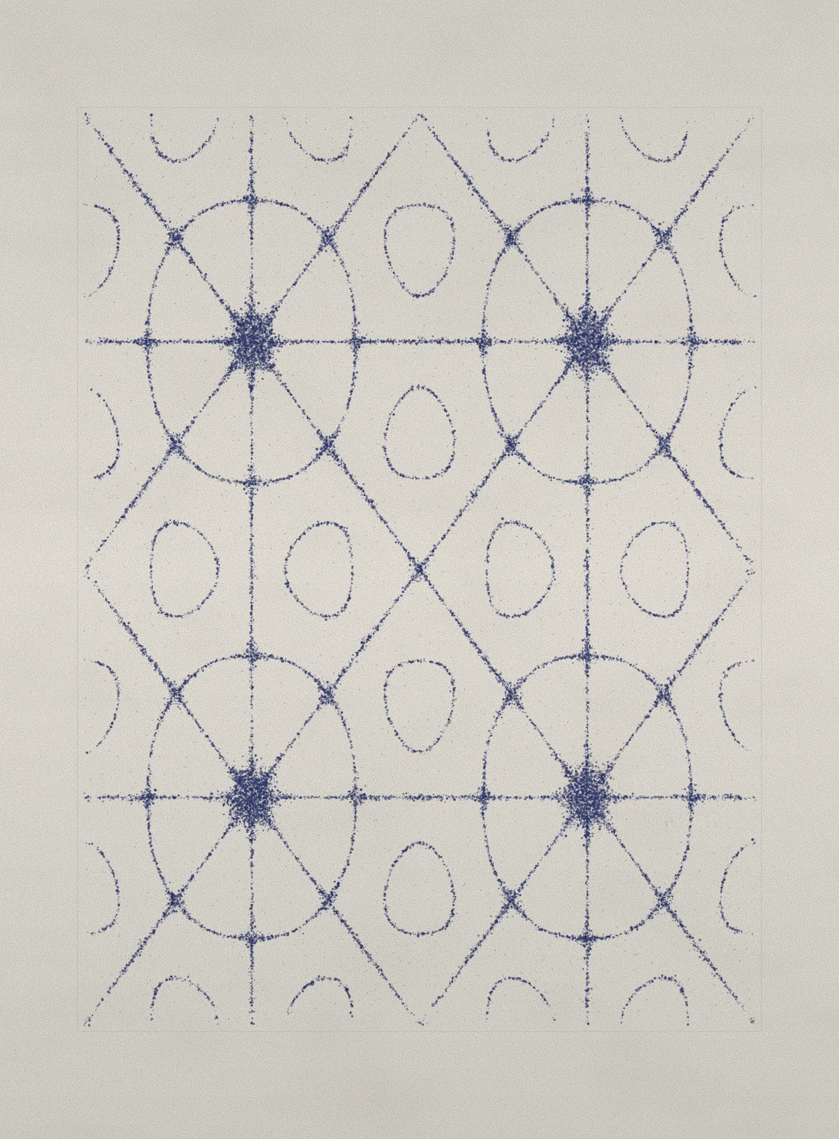 Concentric rings of indigo-blue ink radiating from off-centre points, like a Chladni sand pattern on cotton paper.